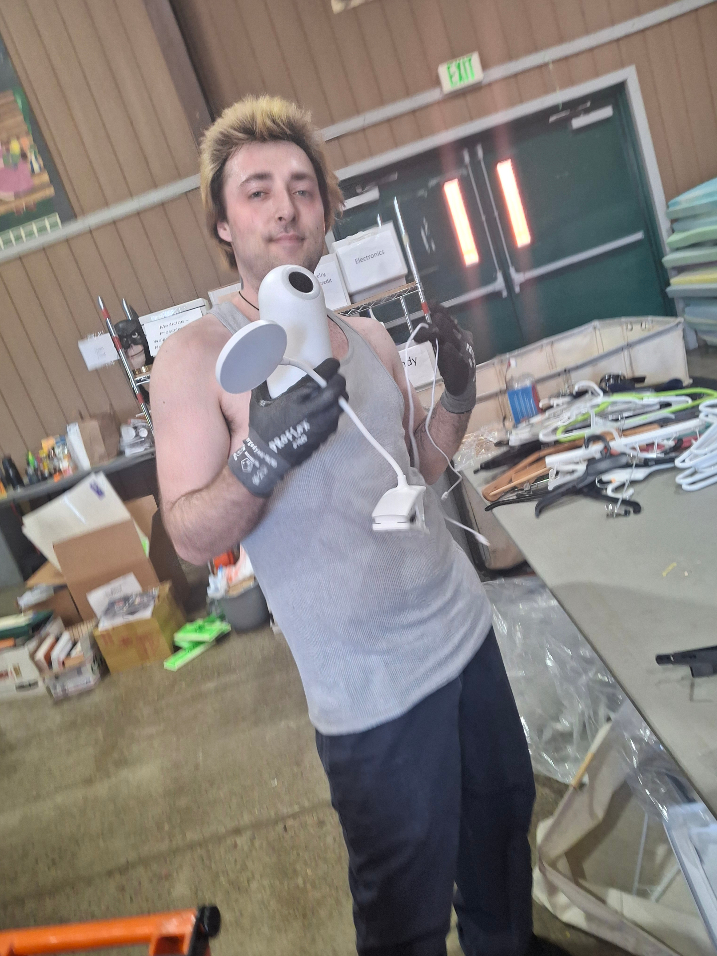 Volunteer with rescued electronics